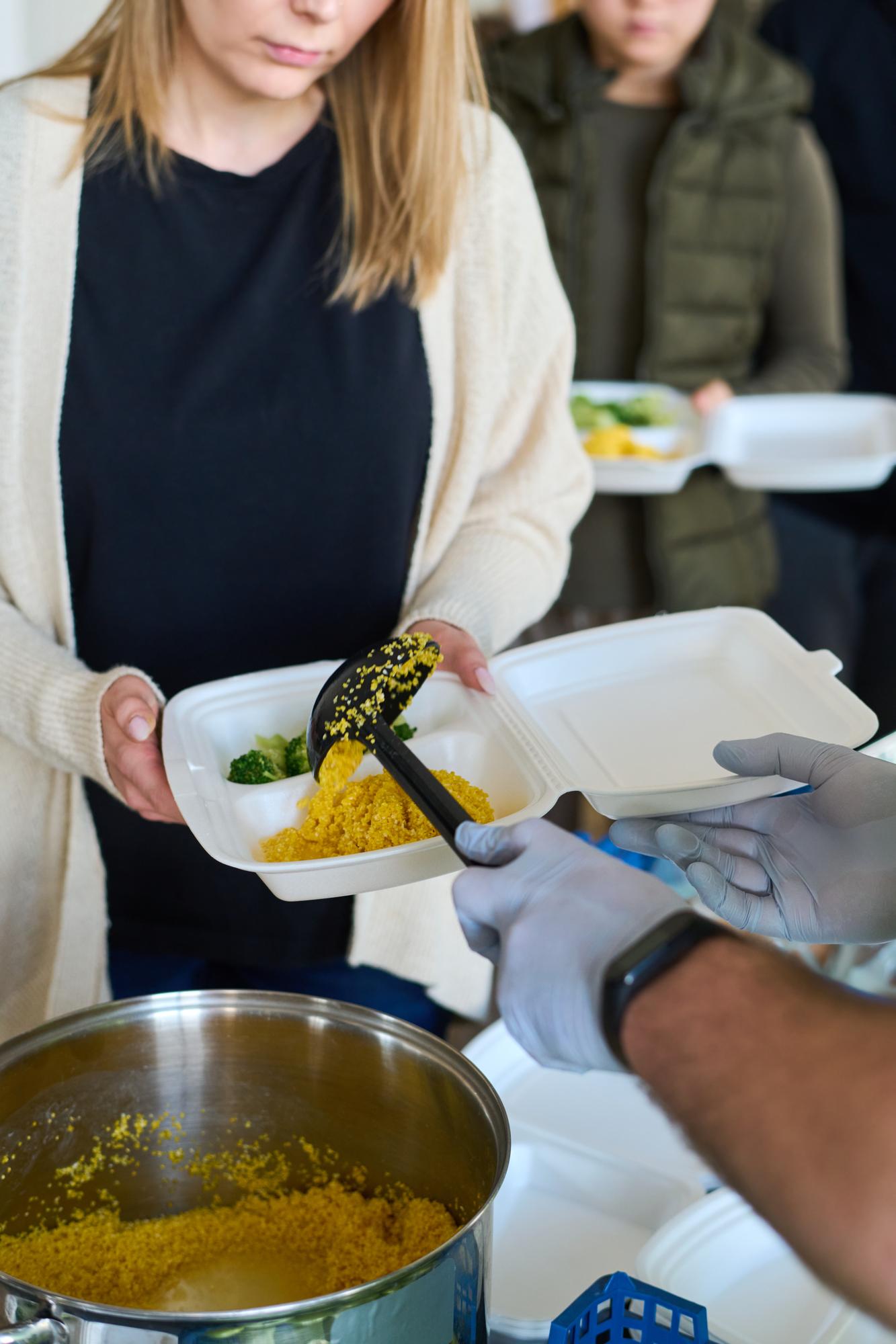 Participant tasting dish in workshop